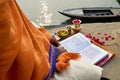 India. Varanasi Benares Uttar Pradesh. A man reading sacred texts of hinduism and praying by the river Ganges at sunrise Royalty Free Stock Photo