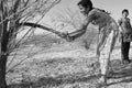 Young indian girls chopping down wood at the national park Little Rann of Kutch in the Gujarat salt desert Royalty Free Stock Photo