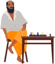 Indian adult man playing chess, clever bearded man sitting at table with chessboard and pieces