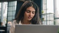 Indian anxious woman with computer working business problem in office Arabian dissatisfied girl worker upset confused Royalty Free Stock Photo