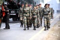 Army men in camouflage uniform casually marching past. Royalty Free Stock Photo