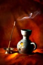 Indian aroma lamp with incense stick and smoke