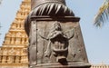 Indian art with Garuda bird on column of traditional Hindu temple. Ancient relief of old religious structure in India