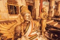 Indian art with metal Garuda sculpture inside traditional Hindu temple. Ancient artwork of India