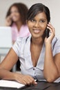 Indian Asian Businesswoman In Office On Cell Phone