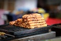 Indian asian chicken tikka, shish, kofta kebabs marinated in spices on charcoal barbeque at culture festival market