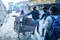 Indian Asian Garbage man collecting garbage in the garbage cart. Concept about