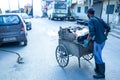 Indian Asian Garbage man collecting garbage in the garbage cart. Concept about