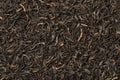 Indian Assam black Harmutty dried tea leaves full frame close up