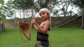 Indian Assamese baby girl in traditional dress with japi.