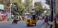 An Indian Auto. An amazing three wheeler special public vehicle that can carry four members. This is also called an Auto Rikshaw.