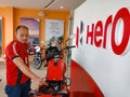 an indian automobile staff presenting latest bike model at hero bike agency in India January 2020