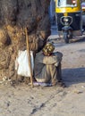 Indian beggar seeking for charity on the street Royalty Free Stock Photo