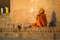 Indian beggar sitting on the street. According to legends, the city was founded by God Shiva about 5000 years ago. Royalty Free Stock Photo