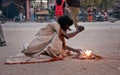 Indian beggar at street in winter