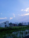 Indian big city looking beautiful water grass houses sky