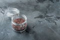 Indian Black salt, Kala namak hindi Healthy food concept, in glass jar, on gray stone background , with copyspace  and space for Royalty Free Stock Photo