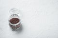 Indian Black salt, Kala namak hindi Healthy food concept, in glass jar, on white stone  background , with copyspace  and space for Royalty Free Stock Photo