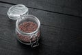 Indian Black salt, Kala namak hindi Healthy food concept, in glass jar, on black wooden background , with copyspace  and space for Royalty Free Stock Photo