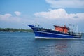 Indian blue fishing boat in the blue ocean