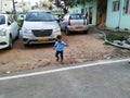 Indian Blue Shirt Wear little Kid in a Big Bazaar Sitting in a Trolley with Cap