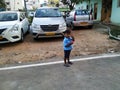 Indian Blue Shirt Wear little Kid in a Big Bazaar Sitting in a Trolley with Cap