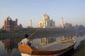 Indian boatman watch the spectacular Taj Mahal Royalty Free Stock Photo