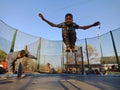 an indian boy on the air during jump on sky background in india January 2020 Royalty Free Stock Photo