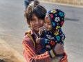 Indian boy with child on the street. Poor people come with family to the city from the village for work. And they living in the