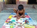 Indian Boy Drawing Beautiful Scenery .