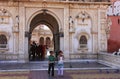 Indian boy and girl going out of Karni Mata Temple, Deshnok, Ind