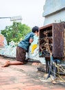 Indian boy near chaotic electrical wiring