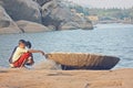 Indian Boys near the boat fishing