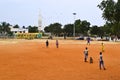 Indian boys playing cricket game on the playground in park. Royalty Free Stock Photo