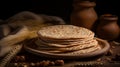 Indian Bread Roti or Chapati with Wheat Ears on Tabletop Background
