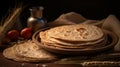 Indian Bread Roti or Chapati with Wheat Ears on Tabletop Background