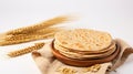 Indian Bread Roti or Chapati with Wheat Ears on Tabletop Background