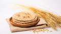 Indian Bread Roti or Chapati with Wheat Ears on Tabletop Background