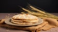 Indian Bread Roti or Chapati with Wheat Ears on Tabletop Background