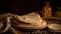 Indian Bread Roti or Chapati with Wheat Ears on Tabletop Background