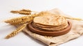 Indian Bread Roti or Chapati with Wheat Ears on Tabletop Background