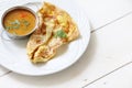Indian bread or Roti telur with curry sauce Royalty Free Stock Photo