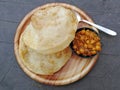 Indian bread and spiced sausse.