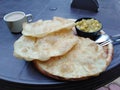 Indian bread and spiced sausse and masala tea.