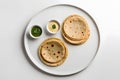 Indian breakfast- aloo paratha. Aloo paratha- Indian potato pancakes served with yogurt dip Royalty Free Stock Photo