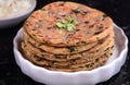 Indian breakfast consisting of parantha and curd