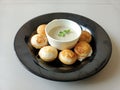 Indian breakfast guliyappa and chatni ina plate