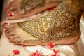 Indian Bride on the eve of her wedding day with henna on her feet.