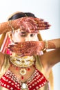 Beautiful Indian Bride with Mehendi hands or Henna