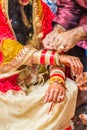 Indian bride with henna painted on arm and hands